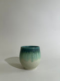 Green and stoneware cup