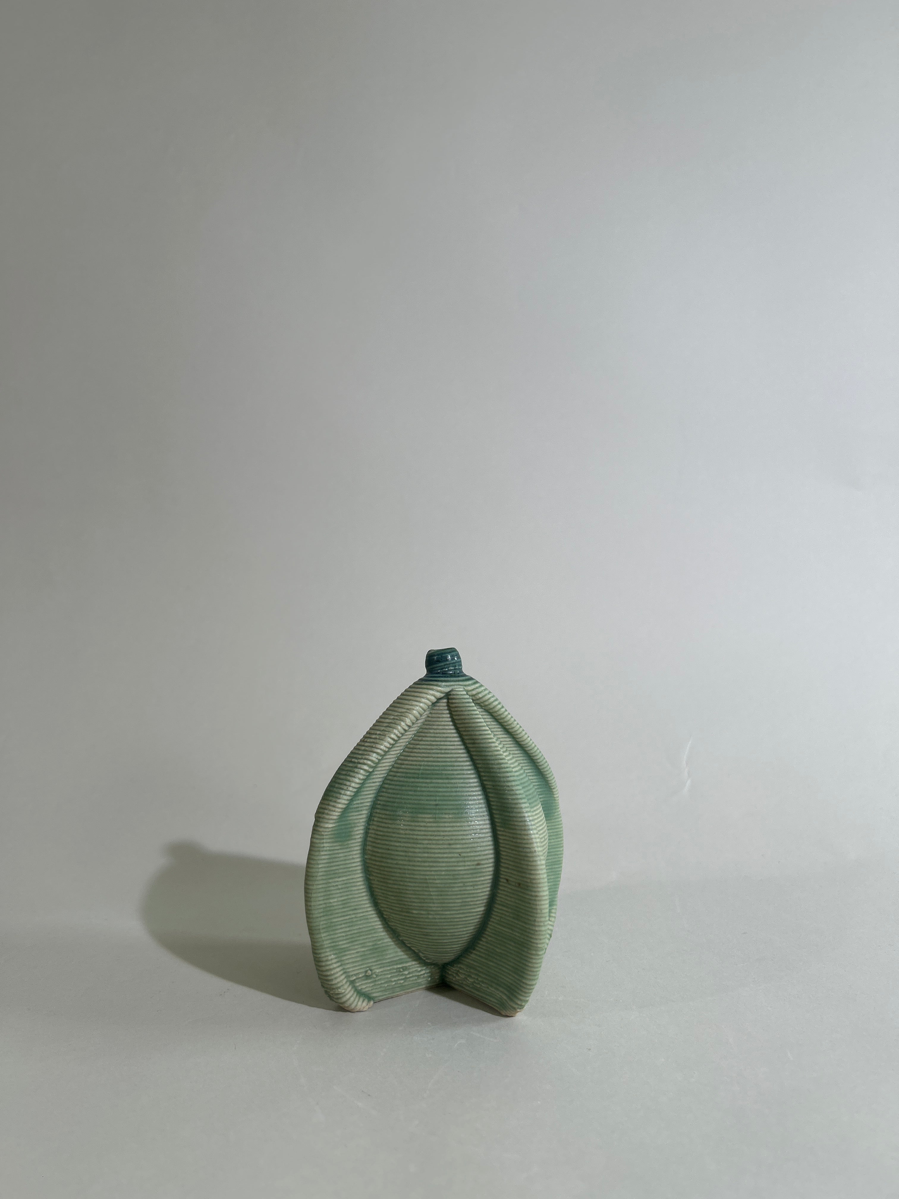 3-D printed green stoneware mini Bottle