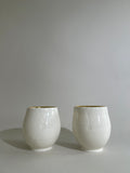 Carved porcelain cup with gold luster