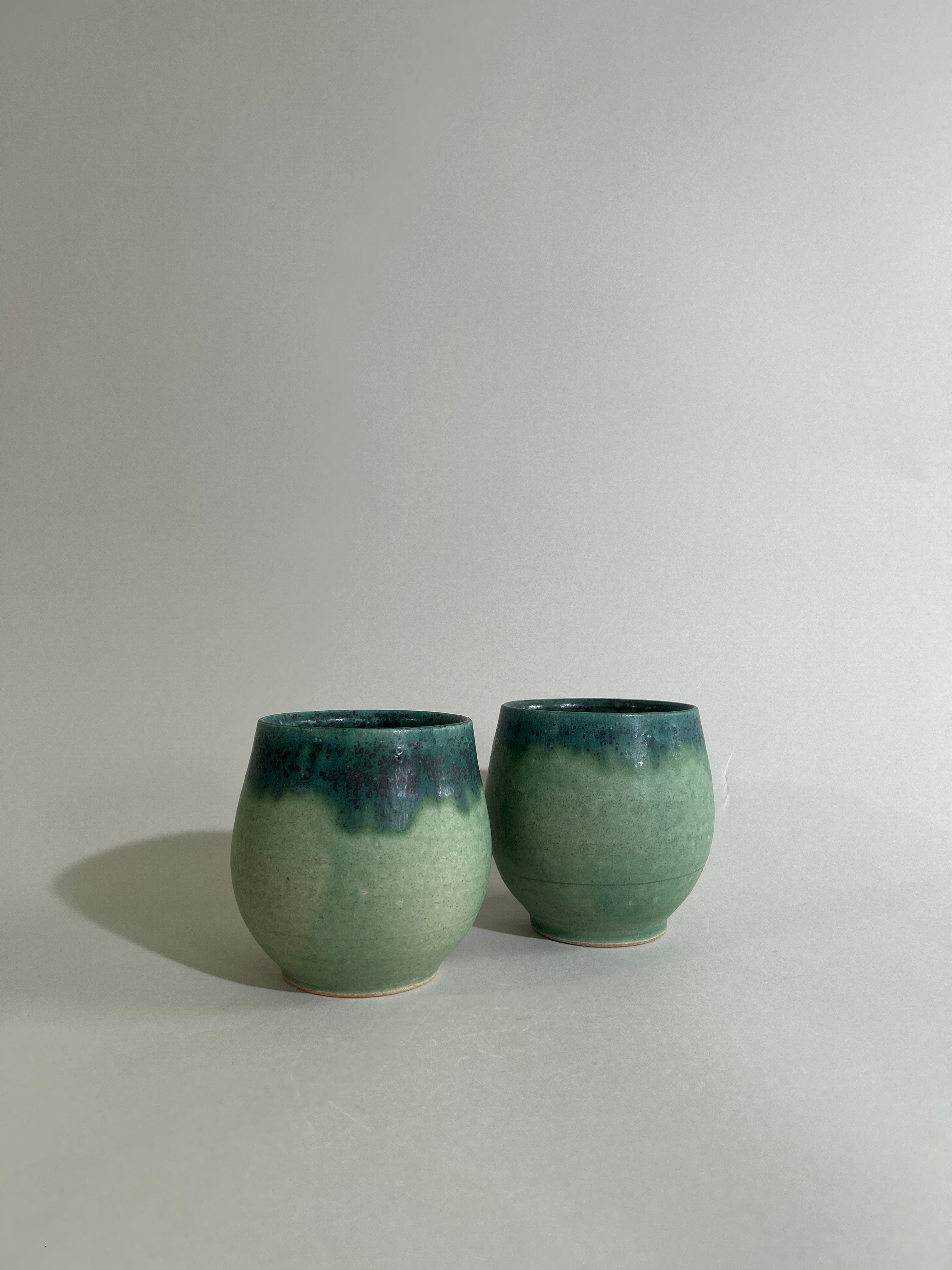 Green stoneware cup
