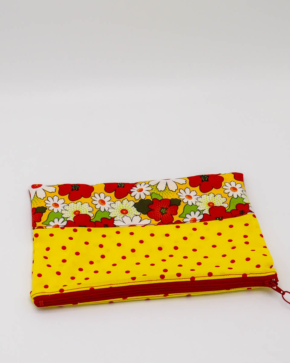7.5x9" Lined Zipper Pouch: Red/yellow floral and yellow w/ red polka dots, red zipper, yellow w/ red polka dots lining