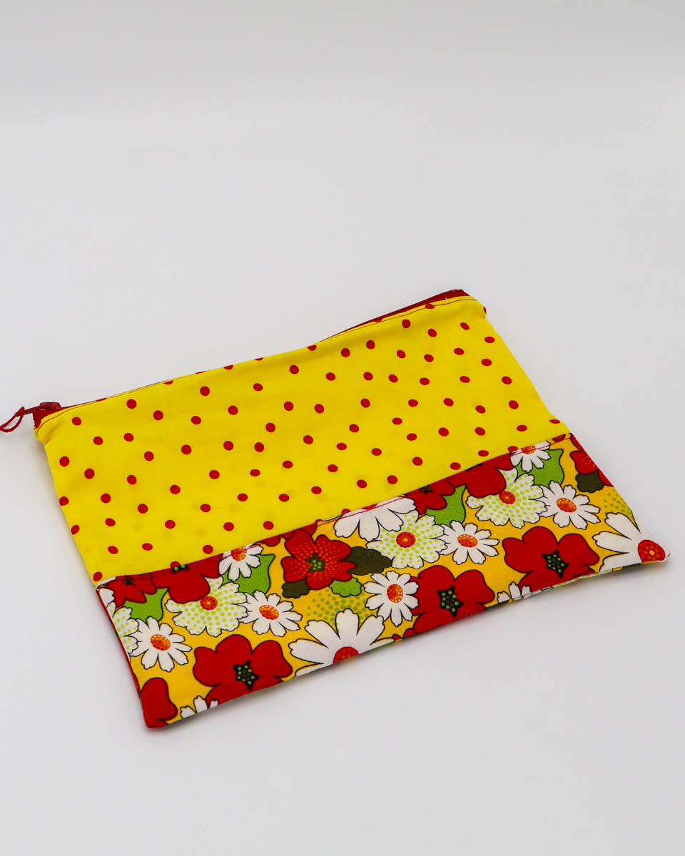 7.5x9" Lined Zipper Pouch: Red/yellow floral and yellow w/ red polka dots, red zipper, yellow w/ red polka dots lining