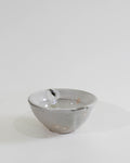 White bowl with ash colored accents